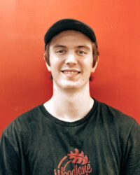 Jett Collins, Machining team member, posing inside our office.