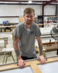 Skylur Blombergh, Production team member, posing inside our office.