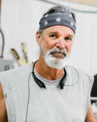 Steve Keeney, Production team member, posing inside our office.
