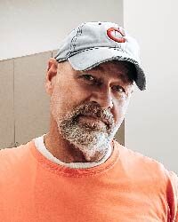 Wayne Grobeli, Installation team member, posing inside our office.